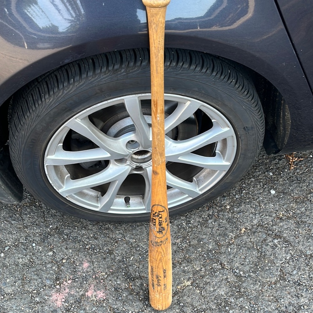 Louisville slugger wooden baseball bat.